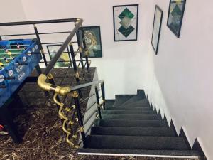 a set of stairs with a rail and a stair case at Urban Haven in Lekki