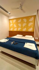 Ένα ή περισσότερα κρεβάτια σε δωμάτιο στο Hotel Ambai Executive