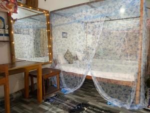 a small room with a bed and a window at Star Rest Arugambay in Arugam Bay +61 photos