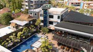 an overhead view of a building with a swimming pool at Sea Beach Hostel & Club AoNang Beachfront in Ao Nang Beach