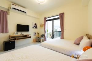 Cama o camas de una habitación en 聚一夏民宿