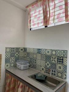 Kuchyň nebo kuchyňský kout v ubytování Caishen Apartelle 201