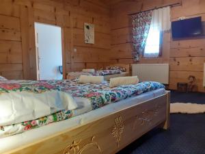Postel nebo postele na pokoji v ubytování Pokoje Gościnne Wierzbówka przy Termach