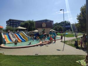 a group of people playing in a water park at Apartments in Zalakaros 48126 in Zalakaros