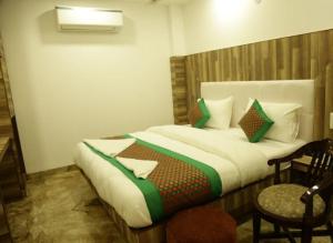 Ein Bett oder Betten in einem Zimmer der Unterkunft Hotel Indo Continental