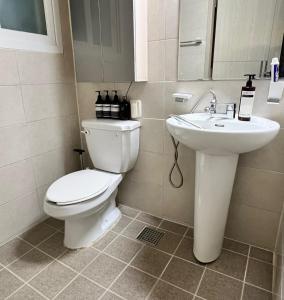 a bathroom with a toilet and a sink at Masil in Seoul