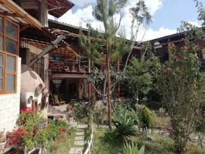 a garden in front of a house at Inka Dream in Cachora