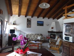 a living room with a couch and a table at Casevacanza Val d'Ayas in Challand Saint Anselme