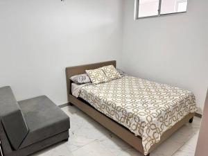 Katil atau katil-katil dalam bilik di Moderno Departamento Via a la costa 10minutos del Consulado Guayaquil