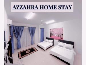 a bedroom with two beds and a sign that readsanya home stay at Az-zahra Home Stay Kulim Hi-Tech in Kulim