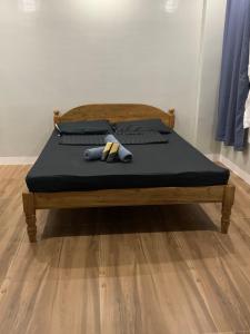 a bed with a teddy bear on top of it at Tending's Rendezvous in Santa Monica