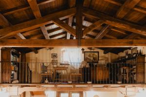 a large room with wooden ceilings and wooden beams at B&B Vicidomini in San Marco dei Cavoti