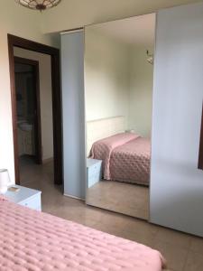 A bed or beds in a room at Residence l'Ogliastro
