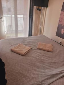 Giường trong phòng chung tại LIBERO 78