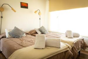 Una cama o camas en una habitación de Buenavista Chalten, Casa de Montaña