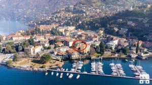 an aerial view of a harbor with boats in the water at VELAHOUSE by Design Studio in Bellano