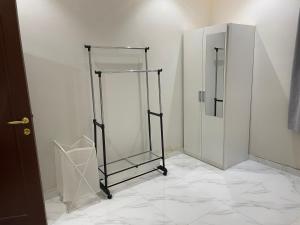 a bathroom with two stalls and a mirror at شقة بيروت 2 in Riyadh