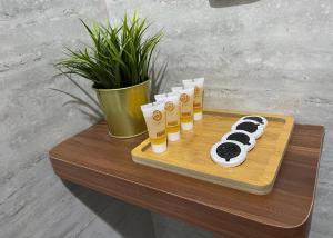 a wooden tray with donuts on top of a table at شقة بيروت 2 in Riyadh