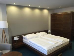 Posteľ alebo postele v izbe v ubytovaní Hotel Arkada