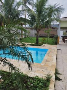 Billede fra billedgalleriet på Piscina 6 QUARTO 300m PRAIA jardim churrasqueira 16 PESSOAS garagem 3 carros Monitoramento 24 horas Mesa de sinuca i Itanhaém