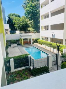 a swimming pool in the middle of a building at 2 Bedroom 2 Bathroom Apartment in Sandton in Johannesburg