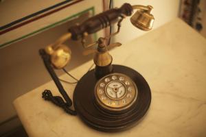 an old fashioned telephone sitting on a table at KothiPushkar in Pushkar