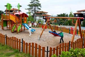 a group of children playing in a playground at Санта Марина-Сладка къща in Sozopol