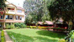 a large yard in front of a house at Red Buffalo House Hotel in Nairobi