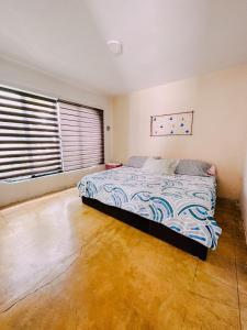 コミタン・デ・ドミンゲスにあるCasa Blancaのベッドルーム1室(ベッド1台付)