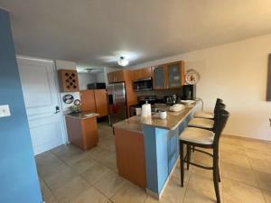 a kitchen with a large island in a room at 3 Bedroom Apt. close to main beaches/ attractions in Rio Grande