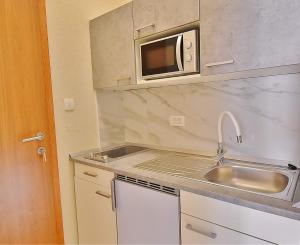 Kuchyň nebo kuchyňský kout v ubytování Guest House Sandra