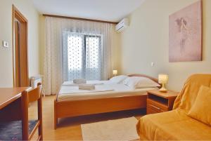 Postel nebo postele na pokoji v ubytování Guest House Sandra