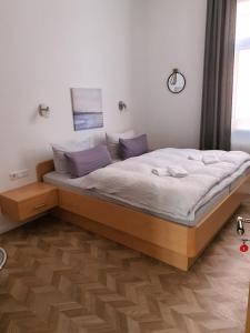 a bedroom with a large bed in a room at Villa Seestern in Juist