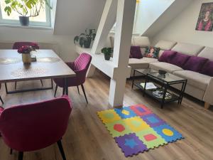 a living room with a couch and a table at Apartmán Frida in Nová Baňa