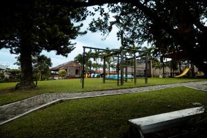 a park with a playground with a slide at Finca Hotel Yerbabuena in Pereira