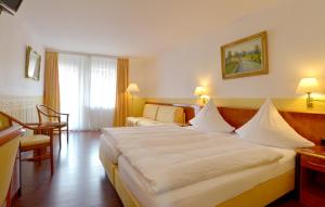 Postel nebo postele na pokoji v ubytování Hotel Zehnthof