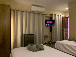 Tempat tidur dalam kamar di Heaven Hostel