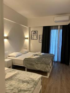 Postel nebo postele na pokoji v ubytování Platon Hotel