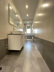 a large bathroom with a sink and a mirror at Yaya's House - Venice in Mestre