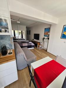 a living room with a bed and a couch at Lovely appartement near sea and Monaco with free parking in Roquebrune-Cap-Martin