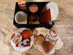 a lunch box with food and snacks on a table at Gasthof Schnittweierbad in Steffisburg