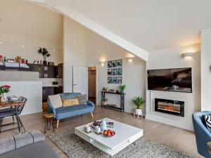 a living room with a couch and a fireplace at 2 Bed in Lizard 45739 in Ruan Major