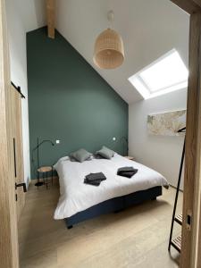 Tempat tidur dalam kamar di La Grange d'Haversin
