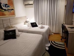 Krevet ili kreveti u jedinici u okviru objekta Lages Plaza Hotel