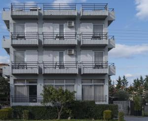 a building with balconies on the side of it at Messini Hotel in Messini