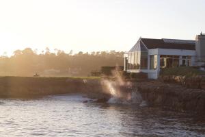 a house on the side of a river at Family Friendly Home in Seaside
