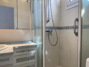 a bathroom with a shower and a sink at 760 - Charmante maison aux Hôpitaux a mi-chemin entre Erquy et la station des Sables d'Or in Erquy +12 photos