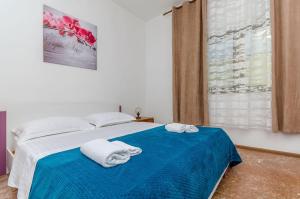 Posteľ alebo postele v izbe v ubytovaní Apartments Tabak