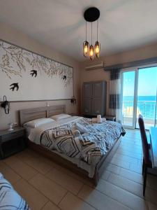 A bed or beds in a room at Panorama Hotel - Restaurant