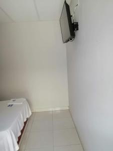 a white room with a tv on a wall at Hotel La Mata in La Mata